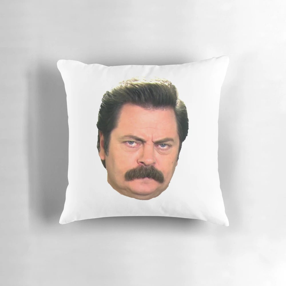 A funny and whimsical pillow featuring the iconic face of Ron Swanson from the TV show Parks and Recreation.