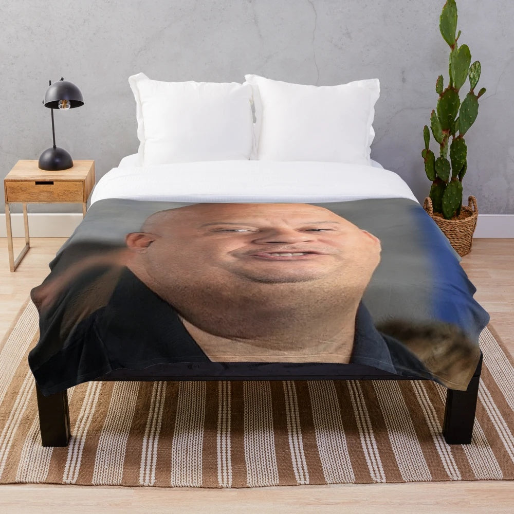 Plush blanket with a humorous depiction of a chubby Vin Diesel