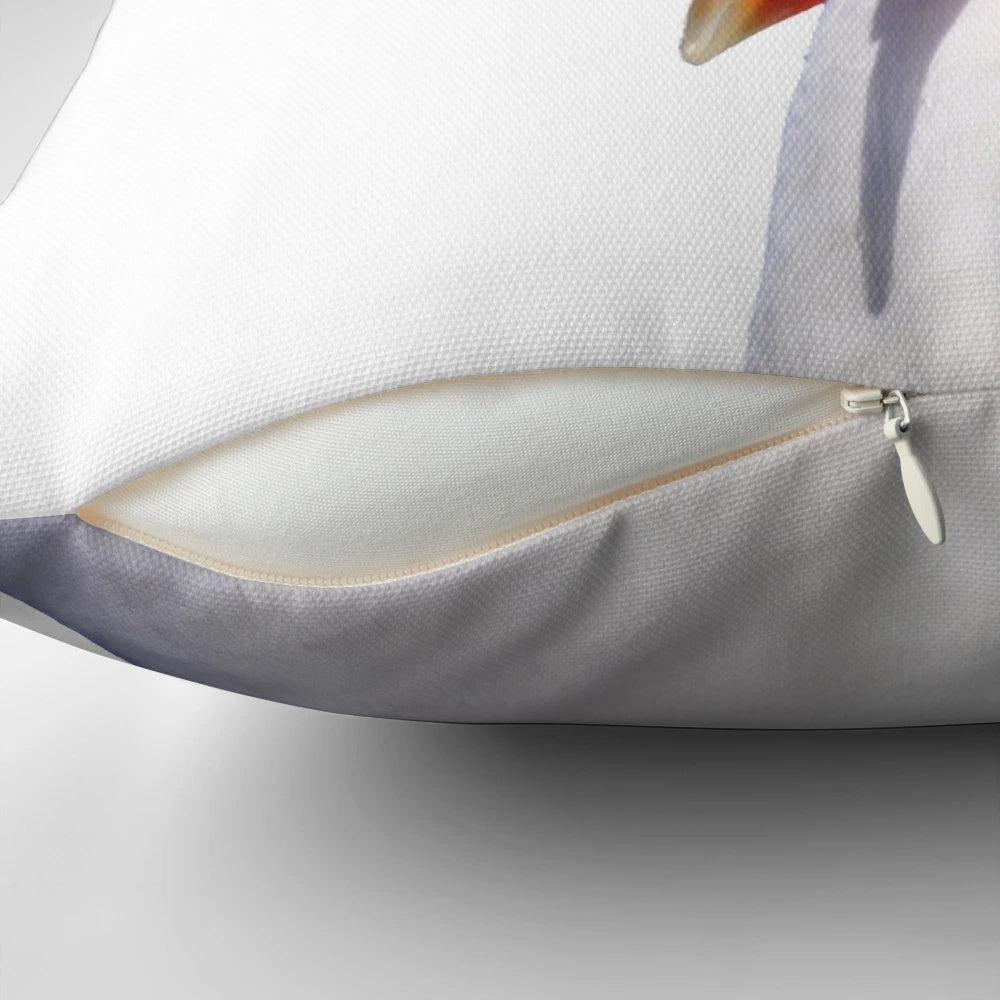 A white and yellow seagull with an open beak screaming on a pillow.