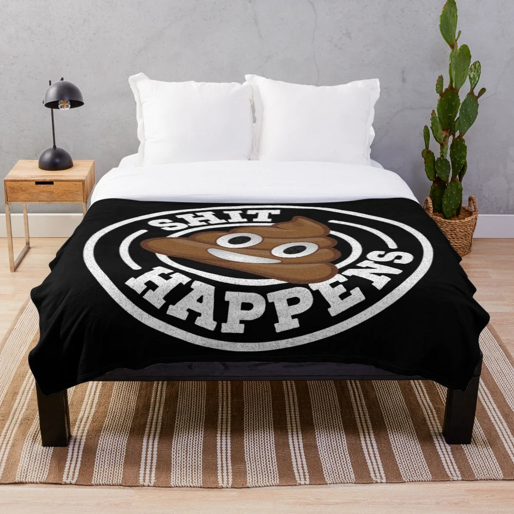 Plush blanket with 'Shit Happens' graphic and poop emoji