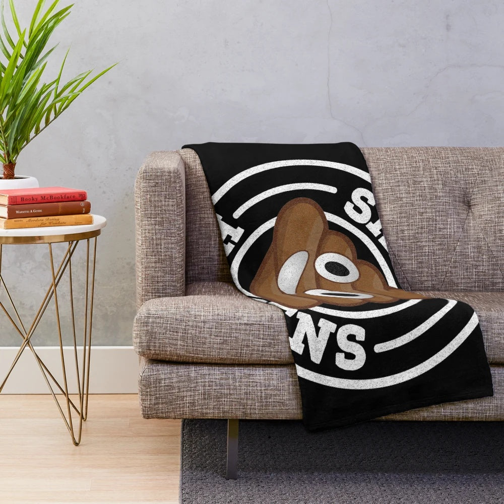 Plush blanket with 'Shit Happens' graphic and poop emoji
