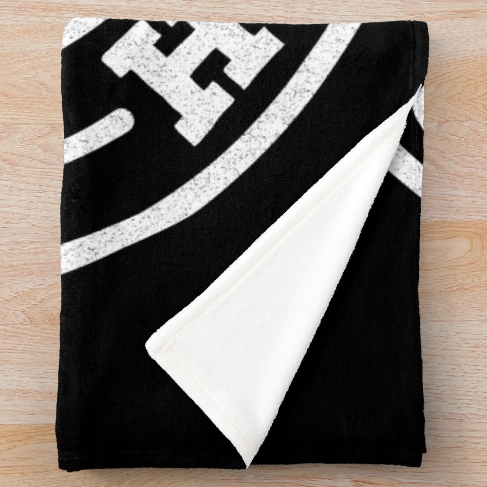 Plush blanket with 'Shit Happens' graphic and poop emoji