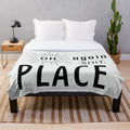 Plush blanket with "Shit Place Office" text, a humorous office-themed design