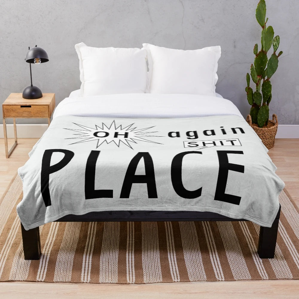 Plush blanket with "Shit Place Office" text, a humorous office-themed design