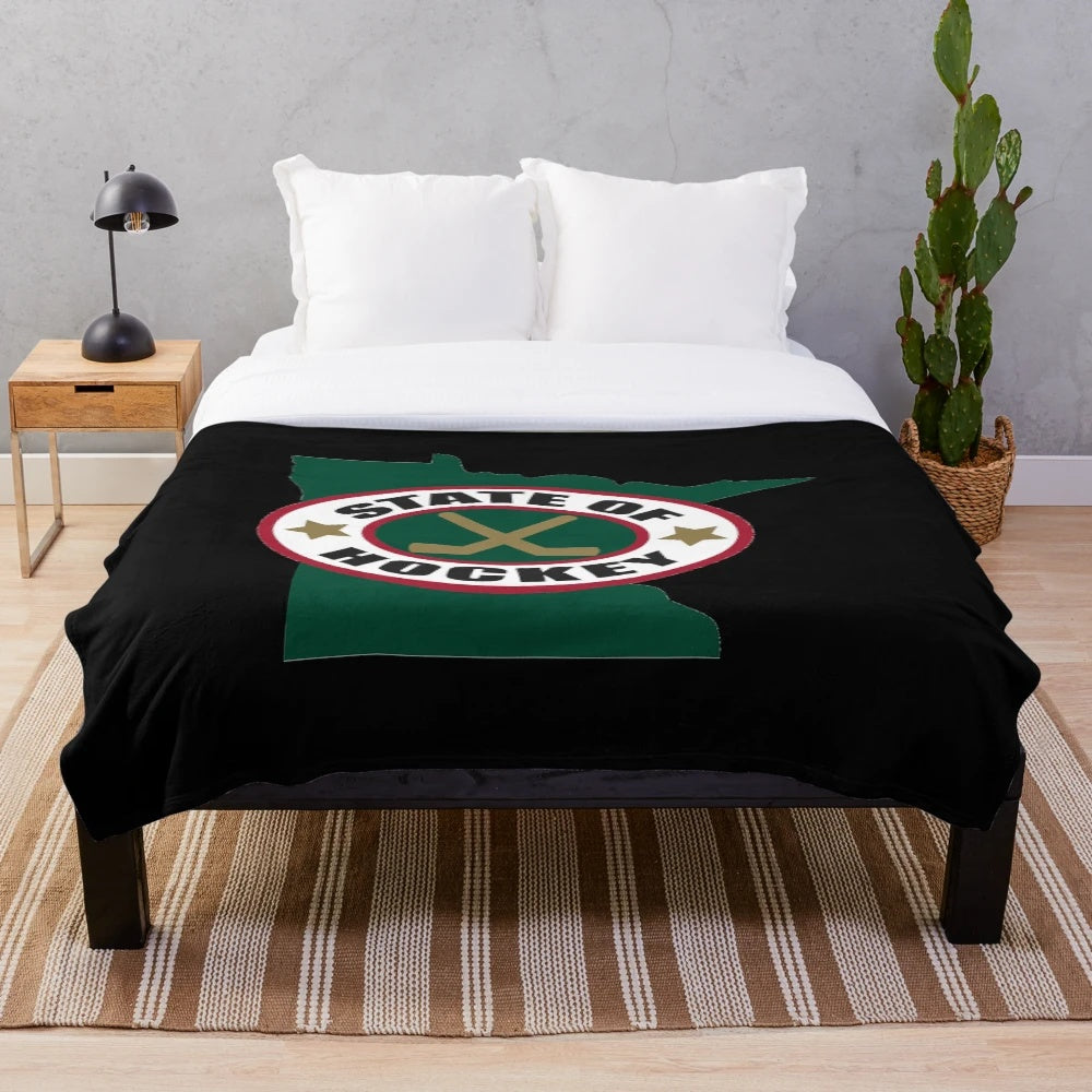 Hockey-themed plush blanket with Minnesota state outline