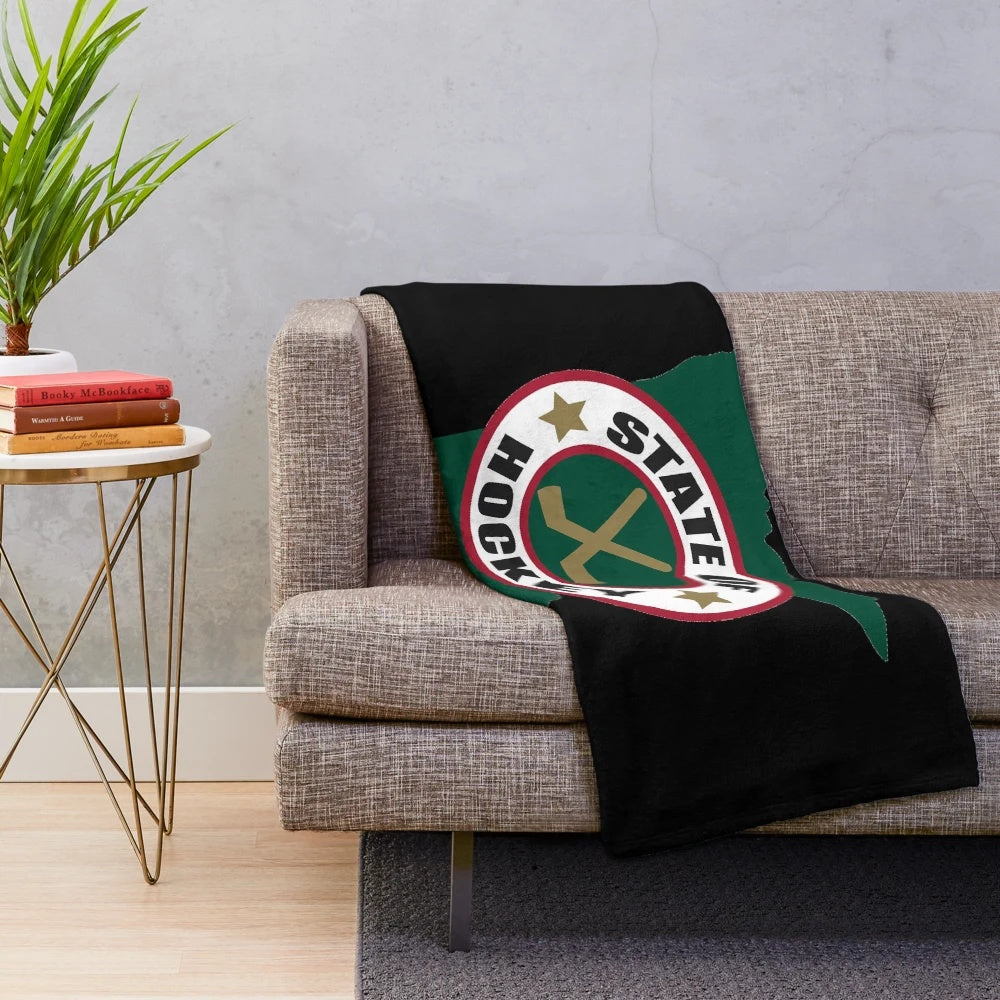 Hockey-themed plush blanket with Minnesota state outline