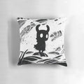 Black and white decorative pillow featuring Hollow Knight characters and game elements