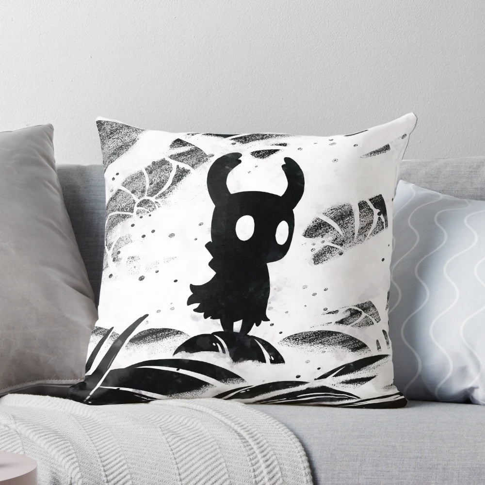 Black and white decorative pillow featuring Hollow Knight characters and game elements