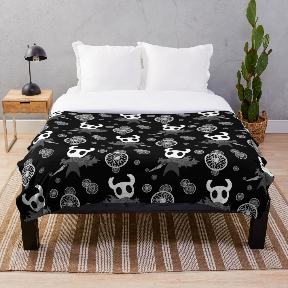 Hollow Knight inspired plush blanket with black and white pattern design