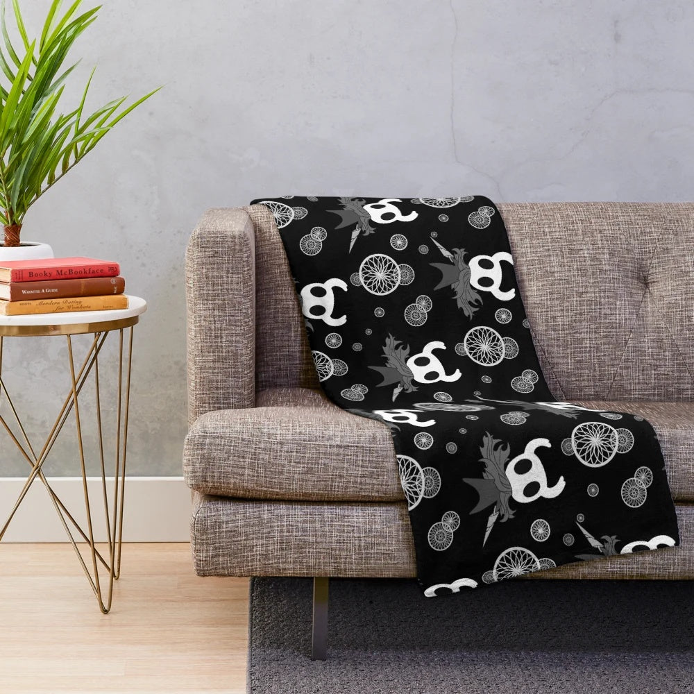 Hollow Knight inspired plush blanket with black and white pattern design