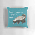 Honey badger decorative pillow with a humorous "Don't Care" design