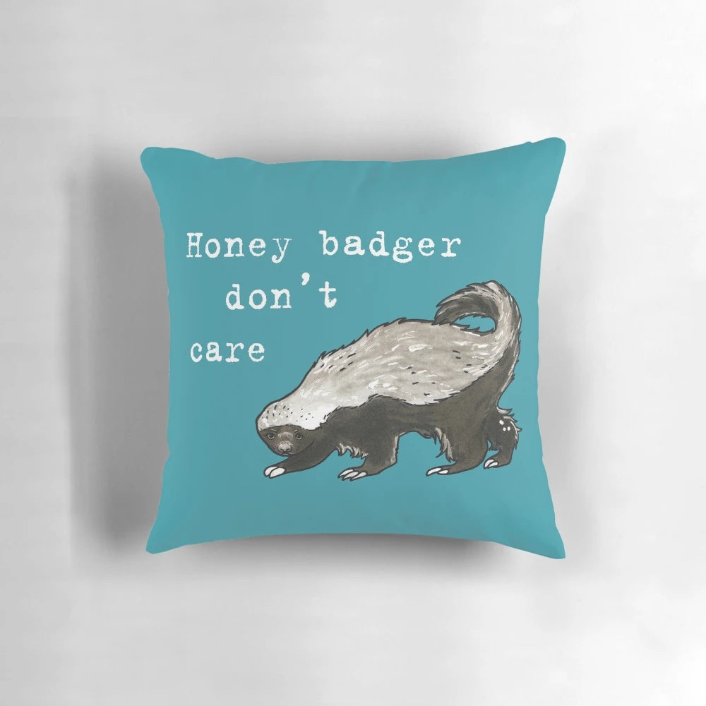 Honey badger decorative pillow with a humorous "Don't Care" design