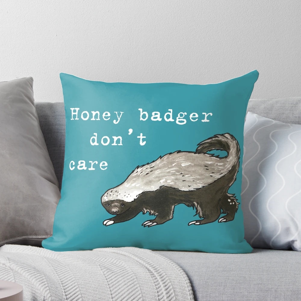 Honey badger decorative pillow with a humorous "Don't Care" design