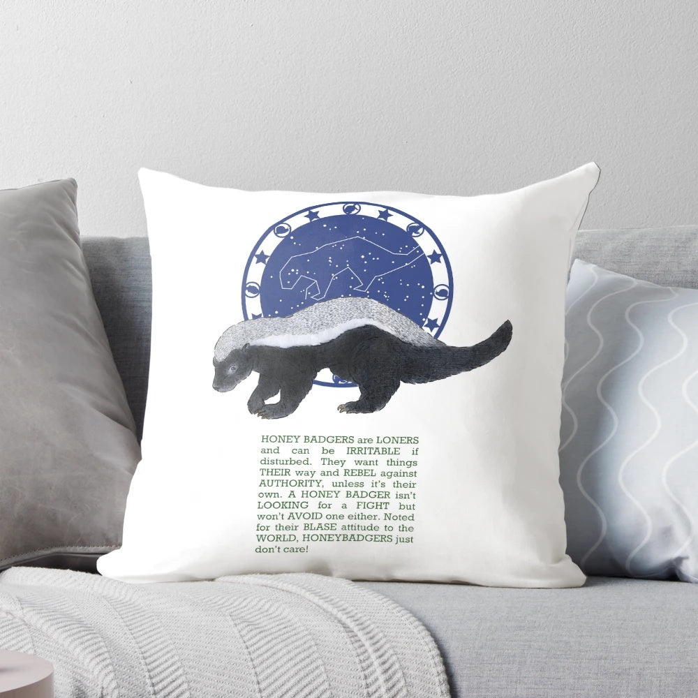 Honey badger illustration on a plush pillow with zodiac stars and symbols