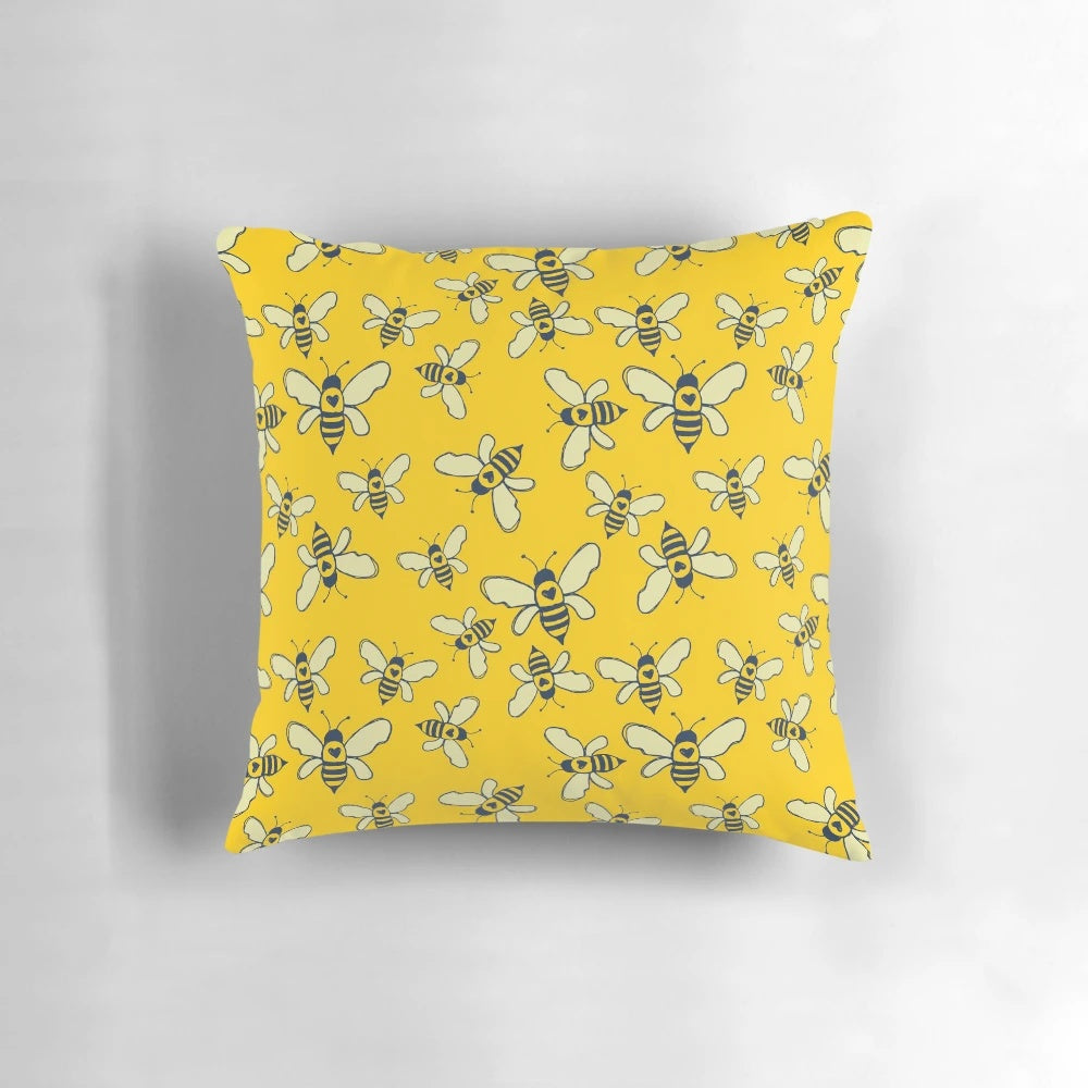 Honey Makers Pillow featuring a design of bees and honeycomb