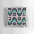 Hoodwinked floral-patterned pillow in teal, aqua, and lime-green colors