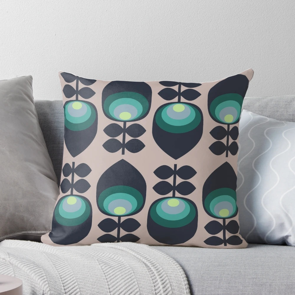 Hoodwinked floral-patterned pillow in teal, aqua, and lime-green colors