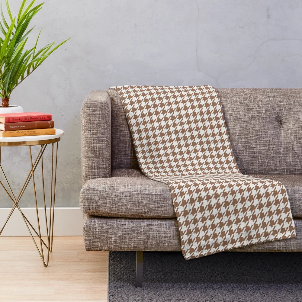 Houndstooth patterned plush blanket in brown and white