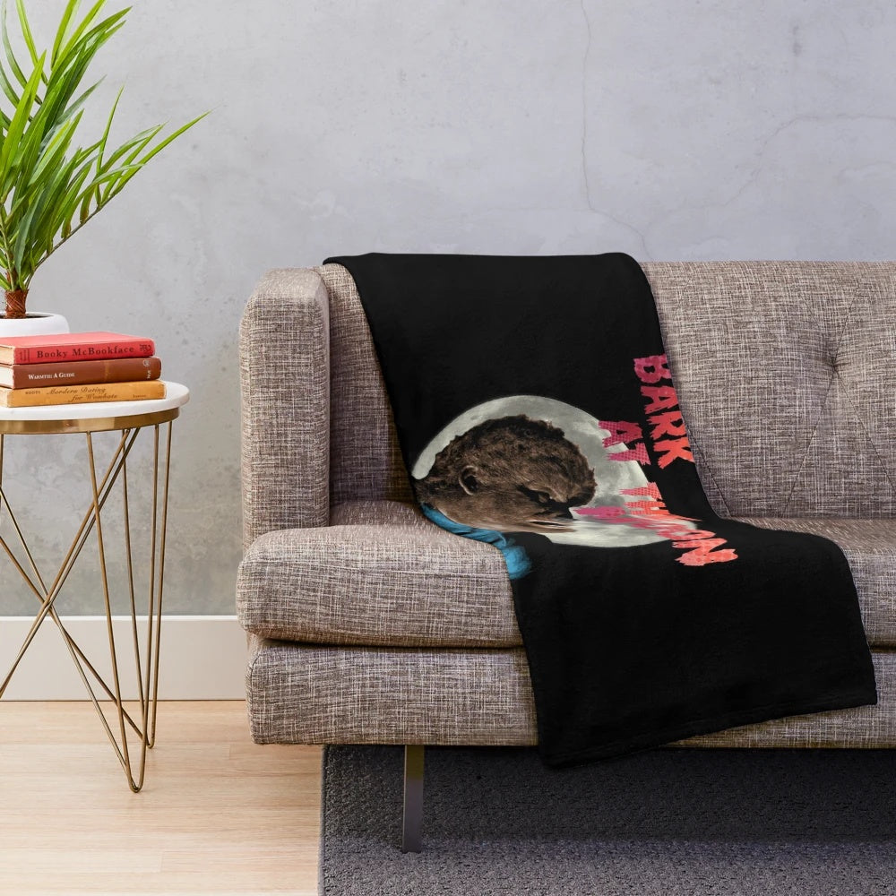 Howling werewolf plush blanket with a dark, retro horror-inspired design featuring a full moon.