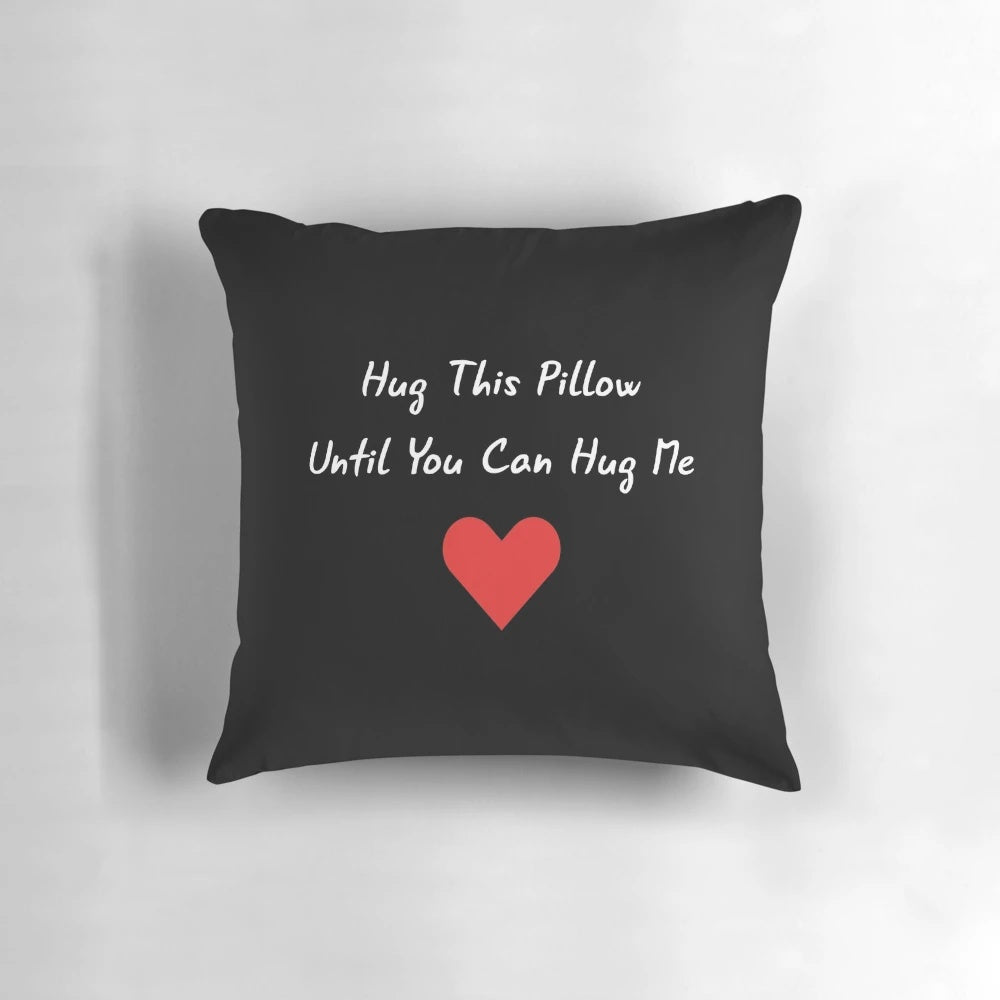 Plush hug pillow for long distance relationships, featuring the text "Hug This Pillow Until You Can Hug Me"