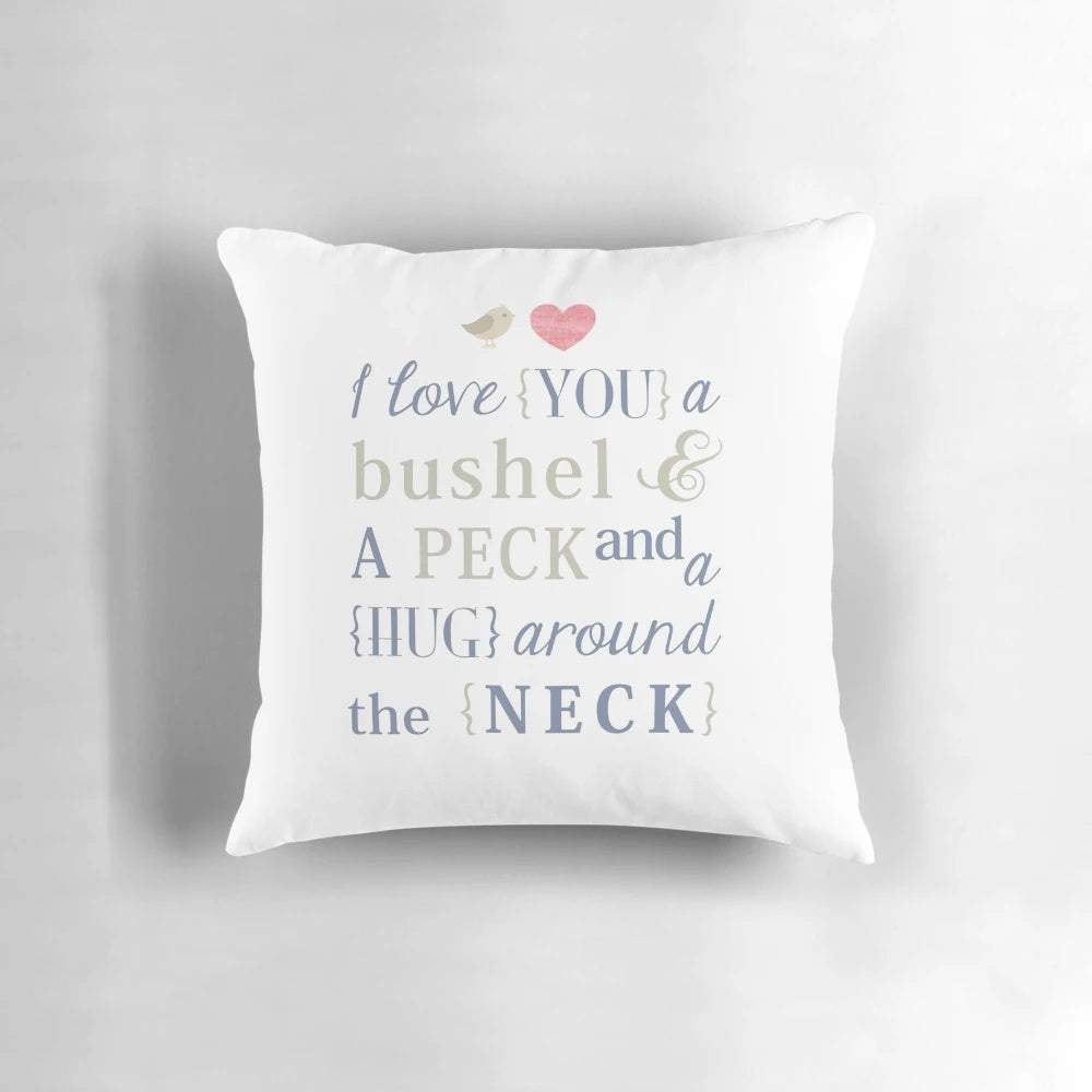 Soft, white throw pillow with the text 'I Love You a Bushel and a Peck & a Hug Around the Neck' printed on it.