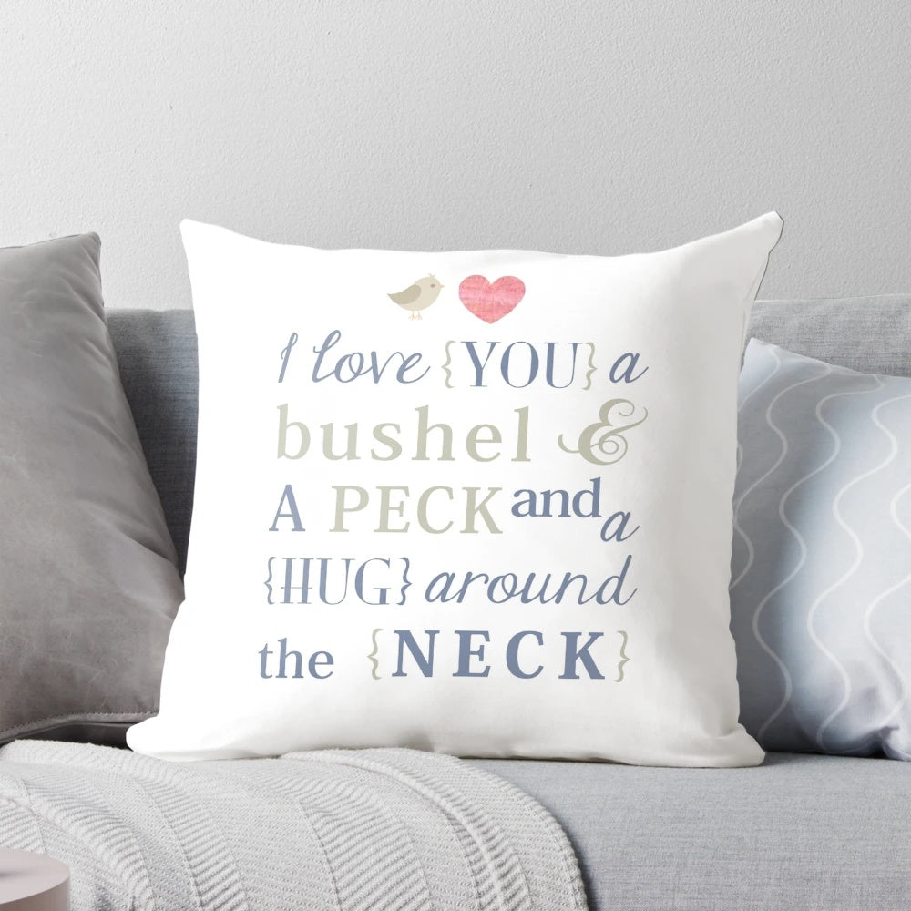 Soft, white throw pillow with the text 'I Love You a Bushel and a Peck & a Hug Around the Neck' printed on it.
