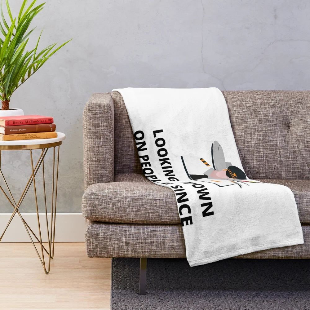Plush blanket with humorous airplane pilot design - "Pilots Looking Down Since 1903
