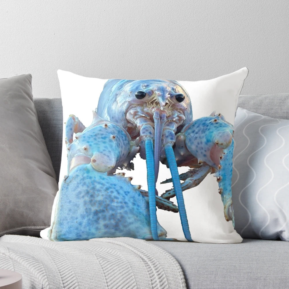 Image of a blue lobster decorative pillow with a playful design.