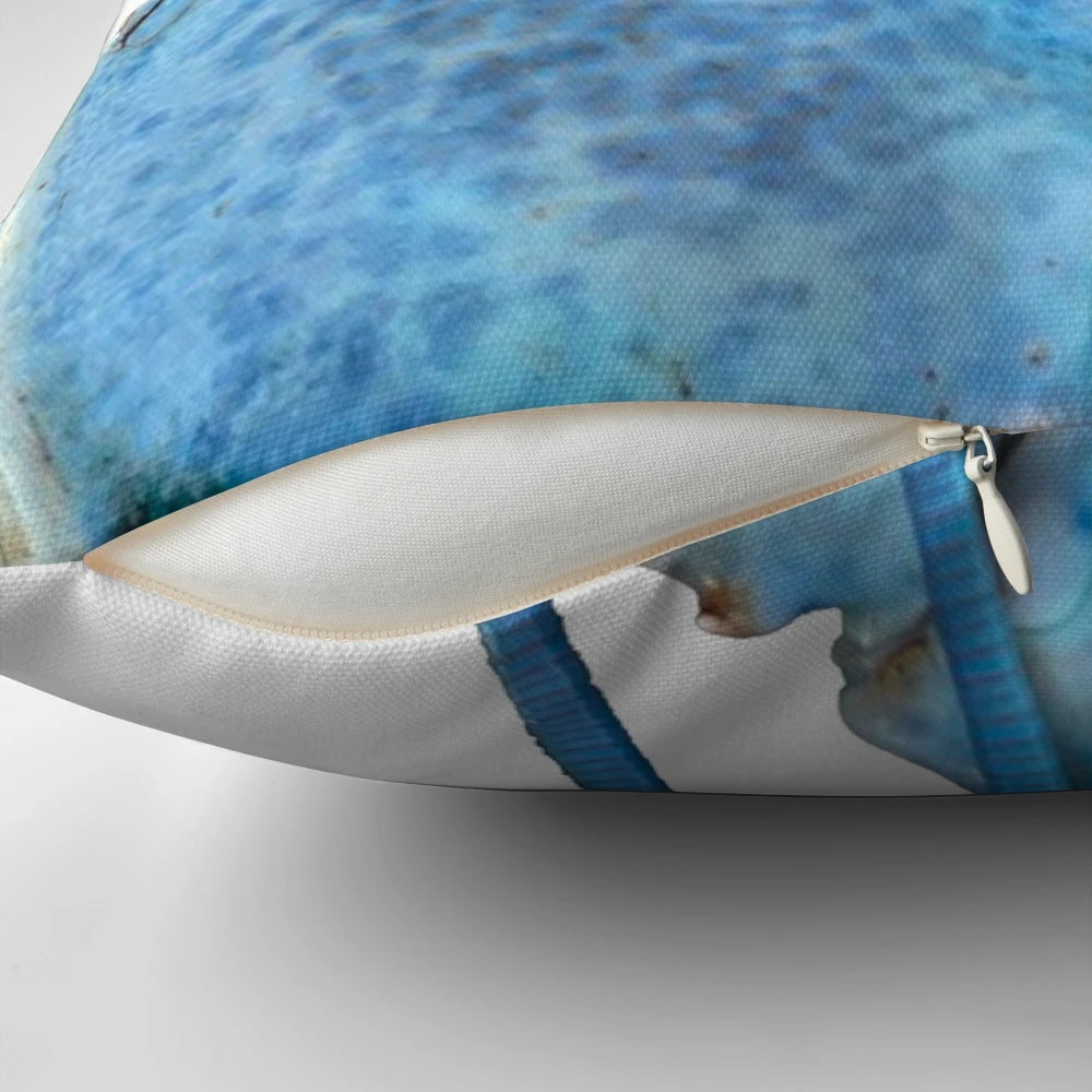 Image of a blue lobster decorative pillow with a playful design.