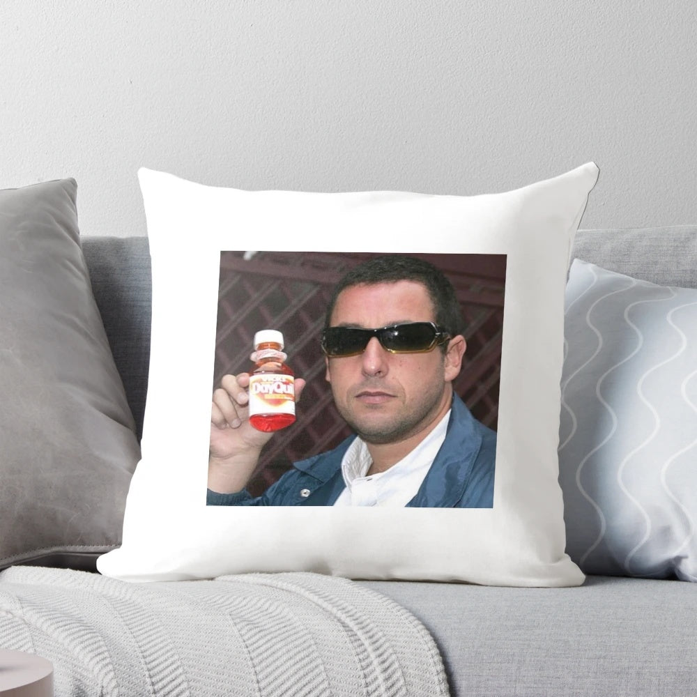 Amusing pillow featuring Adam Sandler's face and "Dayquil" branding