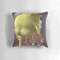 A green, cartoonish pillow with the face of the popular Monster Inc. character Mike Wazowski printed on it.