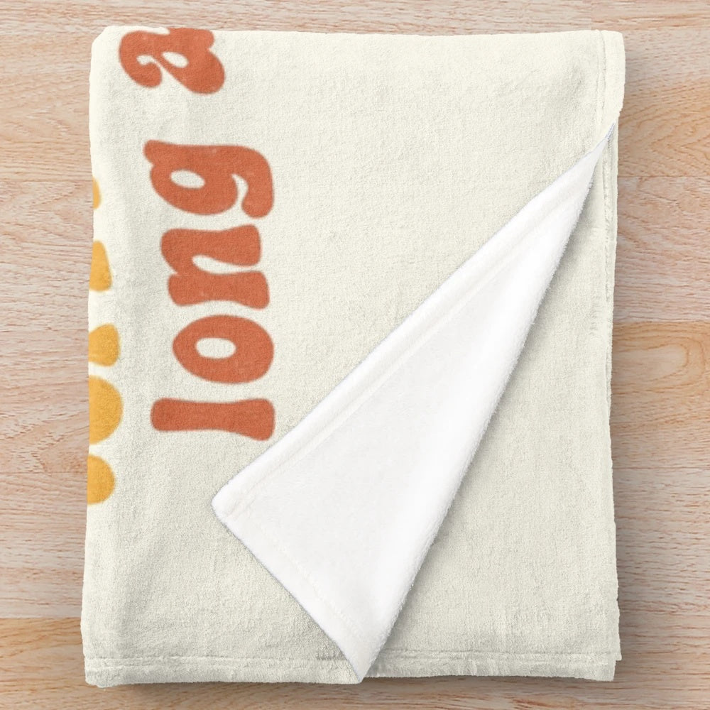 Plush blanket with a humorous message about life's ups and downs