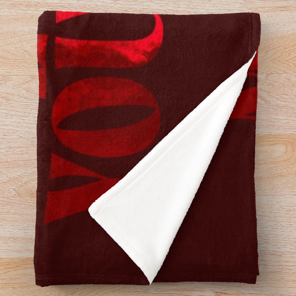 Hunger games inspired plush blanket with mockingjay symbol and district 12 design