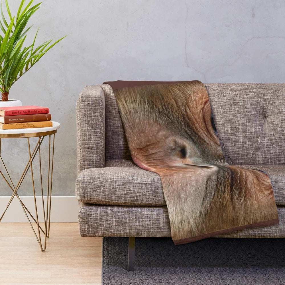 Hyper-realistic plush blanket featuring a funny, shouting monkey design