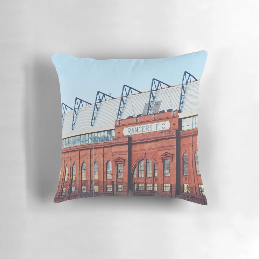 Pillow featuring a photograph of Ibrox Stadium in Glasgow, Scotland at blue hour.