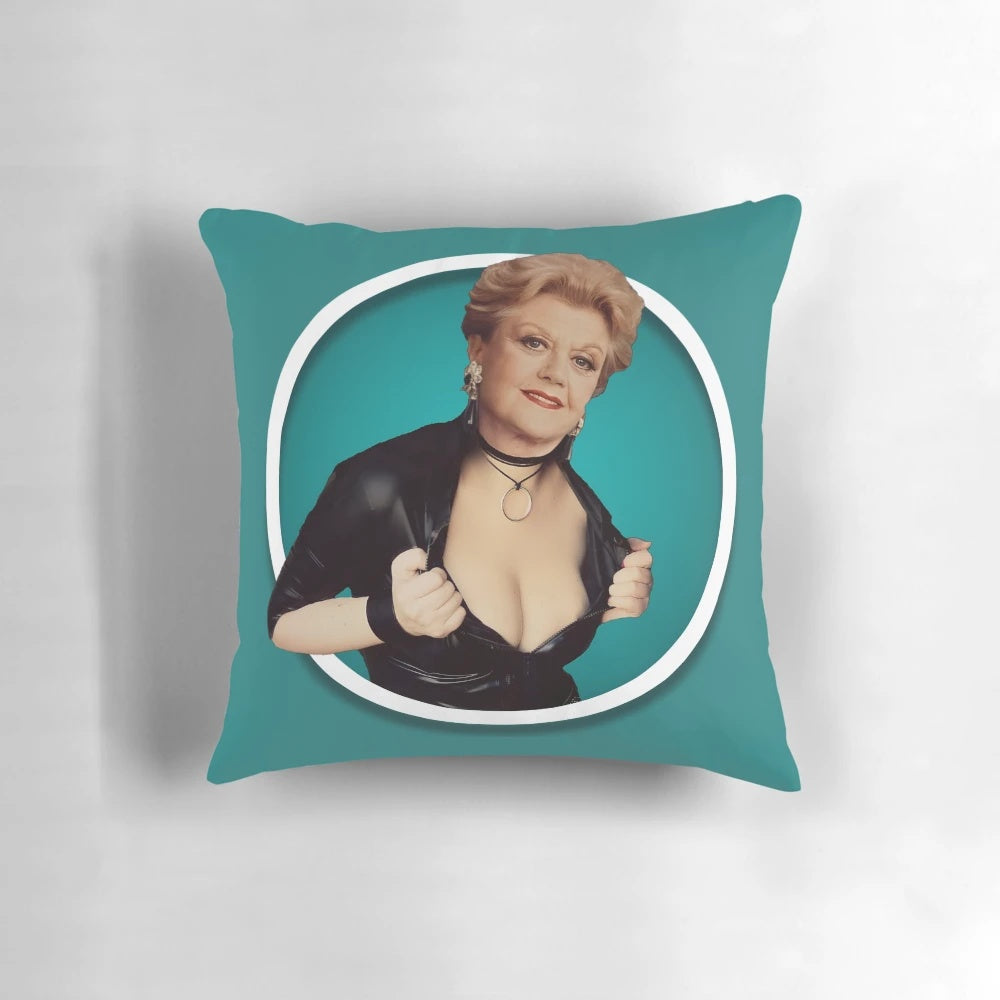 Colorful and whimsical pillow featuring the iconic character Jessica Fletcher from the 1980s TV show "Murder, She Wrote" played by Angela Lansbury.