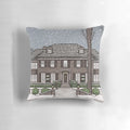 A cozy Christmas pillow featuring the home from the classic 1990 film "Home Alone"
