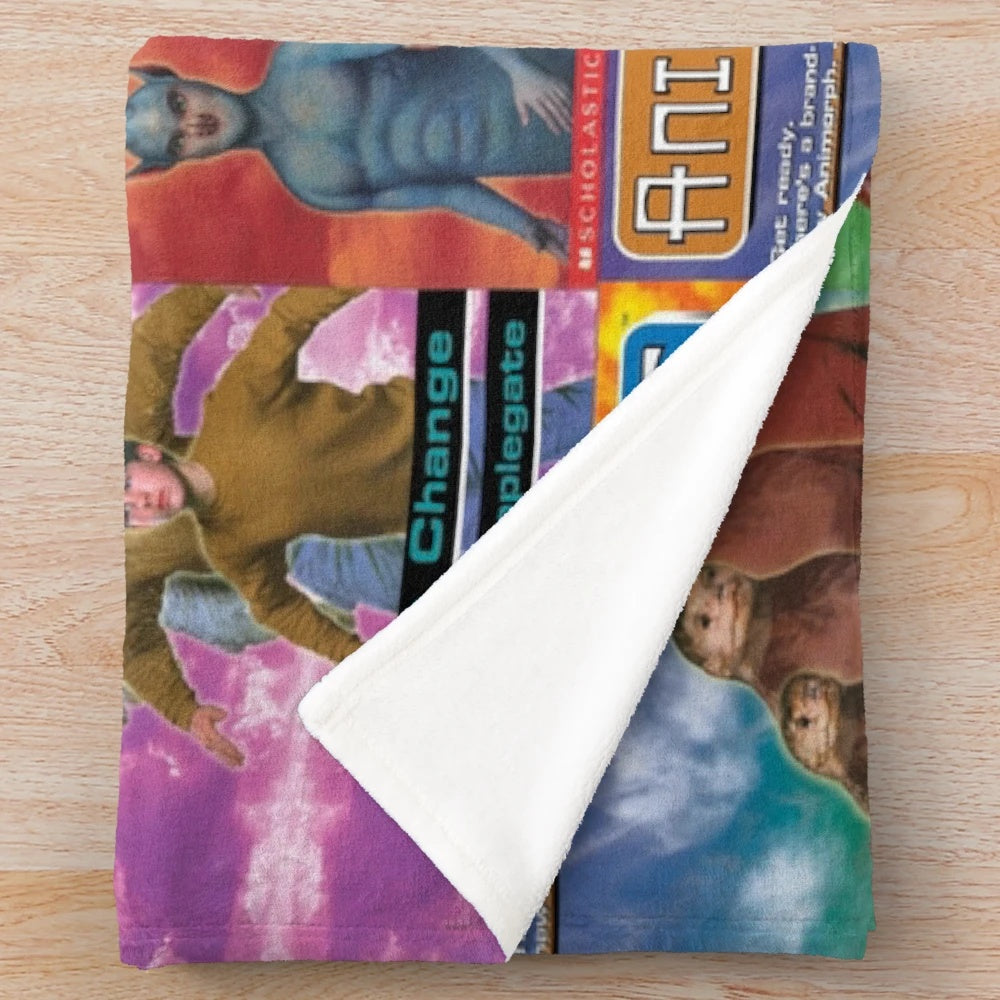 Plush blanket featuring tiled design of Animorphs book covers
