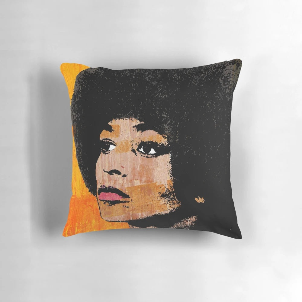 Vibrant pop art portrait of American civil rights activist Angela Davis printed on a soft, comfortable pillow.
