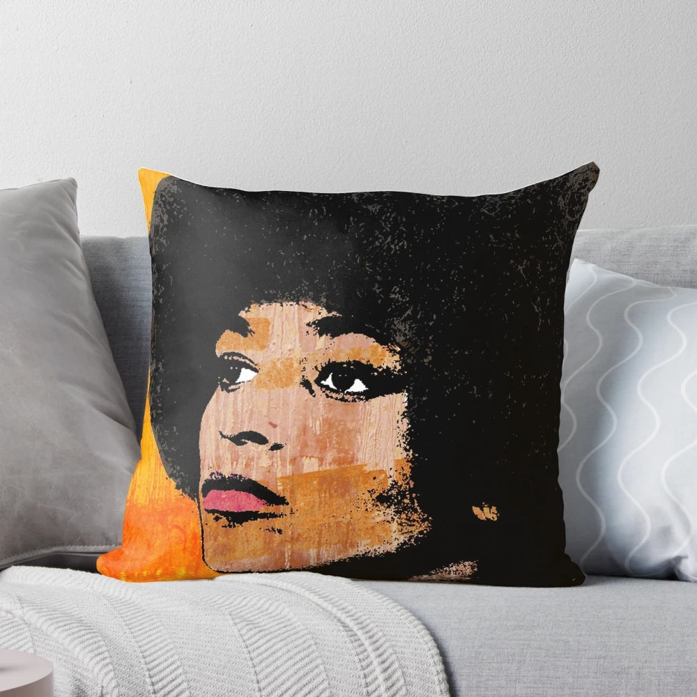 Vibrant pop art portrait of American civil rights activist Angela Davis printed on a soft, comfortable pillow.