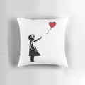 Decorative pillow featuring the iconic Banksy street art image of a girl reaching for a heart-shaped balloon.