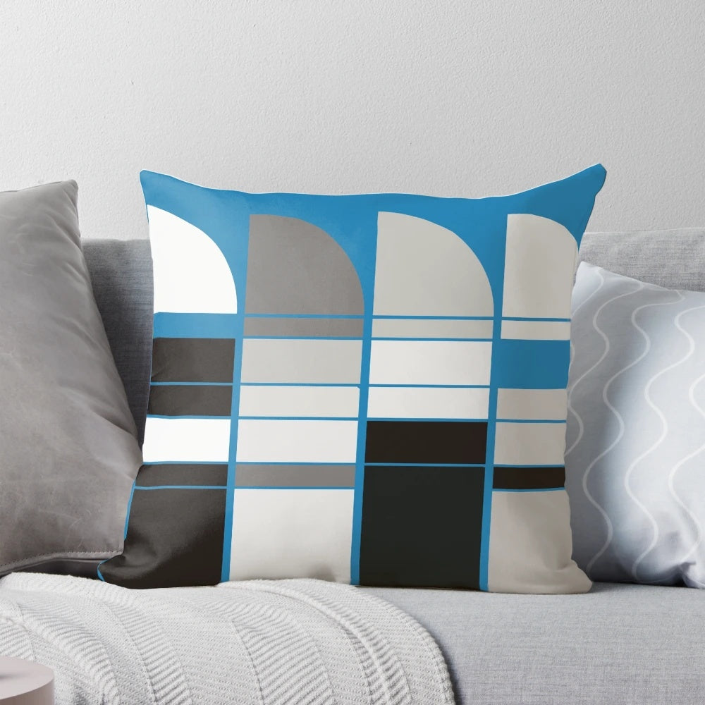 Bauhaus-inspired pillow with abstract blue, grey, and yellow geometric design