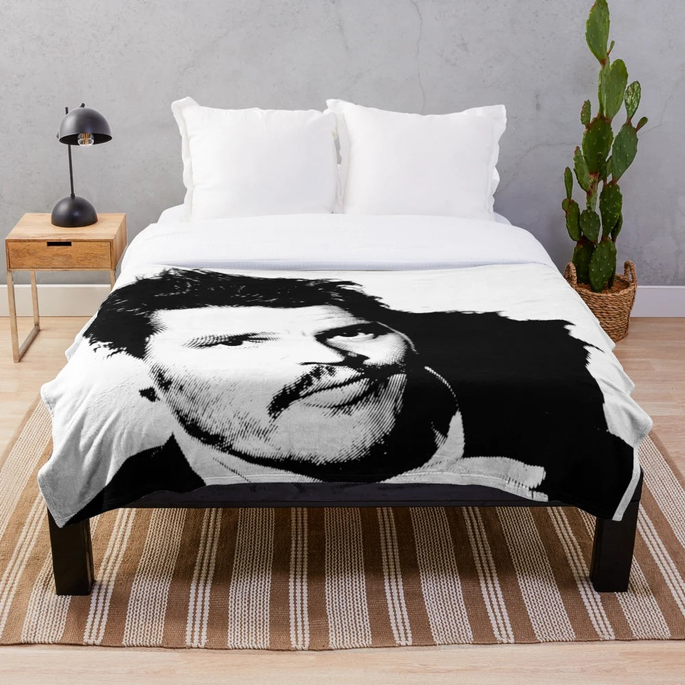 Plush blanket featuring a black and white portrait of Pedro Pascal, the acclaimed American actor