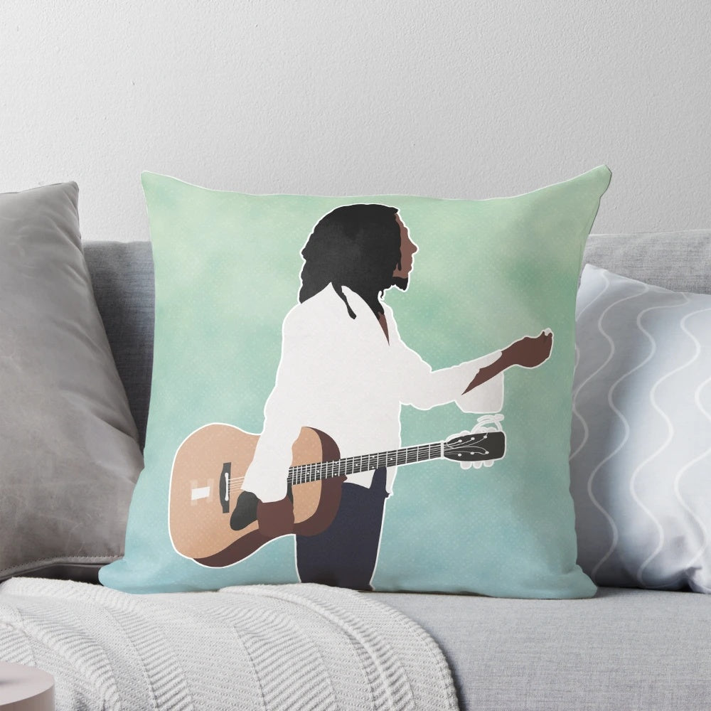 Plush Bob Marley themed pillow with vibrant reggae imagery and lyrics