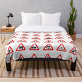 Plush blanket featuring iconic British road signs