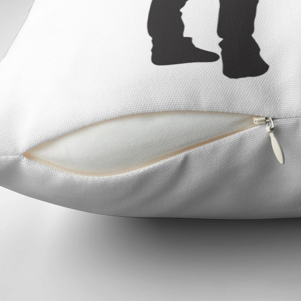 Pillow featuring artwork of the Banksy "Girl with Balloon" design and Robert Smith of The Cure
