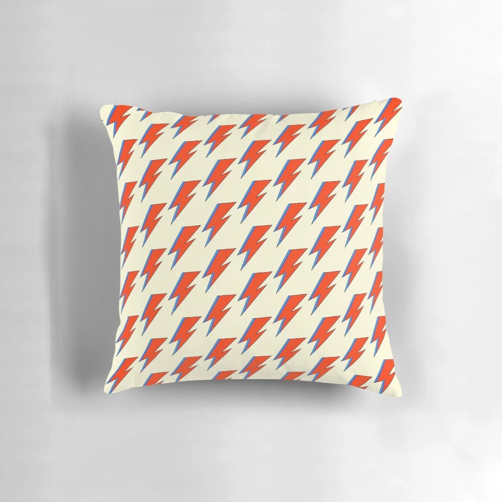 "A decorative pillow featuring the iconic lightning bolt design from David Bowie's Aladdin Sane album cover"