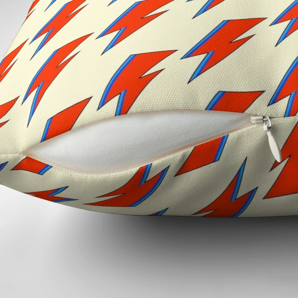 "A decorative pillow featuring the iconic lightning bolt design from David Bowie's Aladdin Sane album cover"