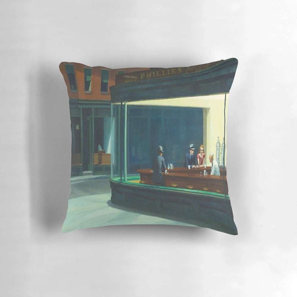 Reproduction of Edward Hopper's famous "Nighthawks" painting on a decorative pillow