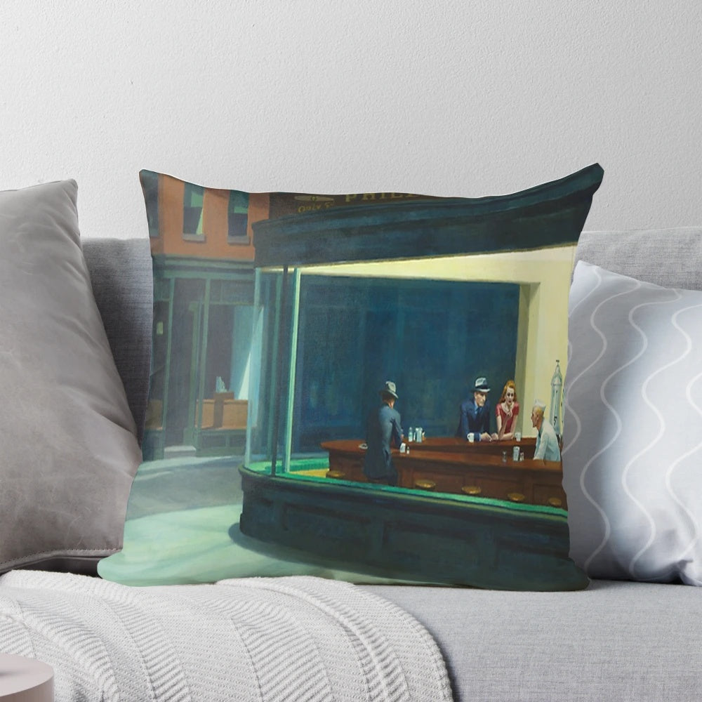 Reproduction of Edward Hopper's famous "Nighthawks" painting on a decorative pillow